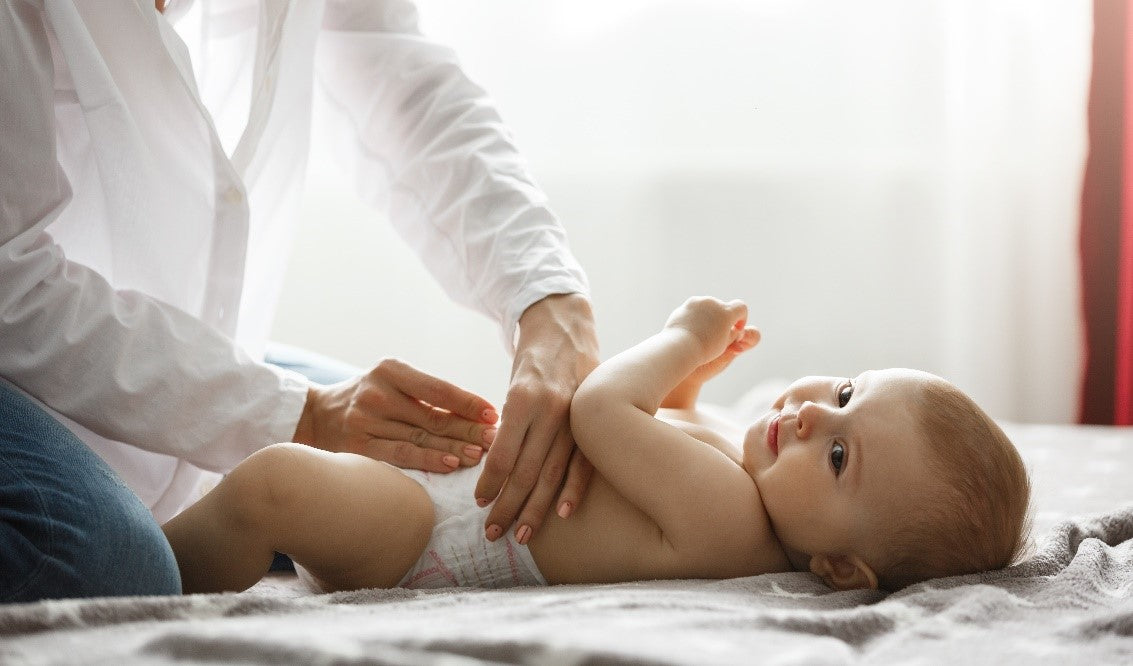 What Is The First Step To Take When Dressing A Baby?