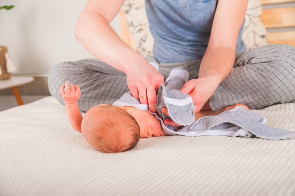 Dressing newborn baby